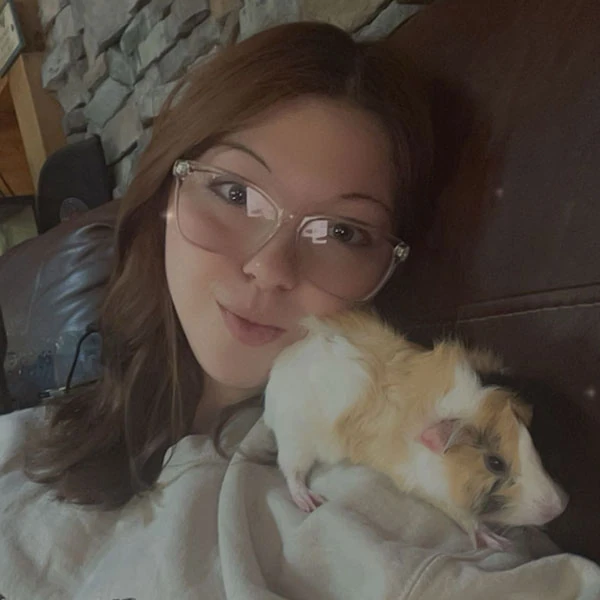 Tiffany, LVMT, with a white and tan guinea pig